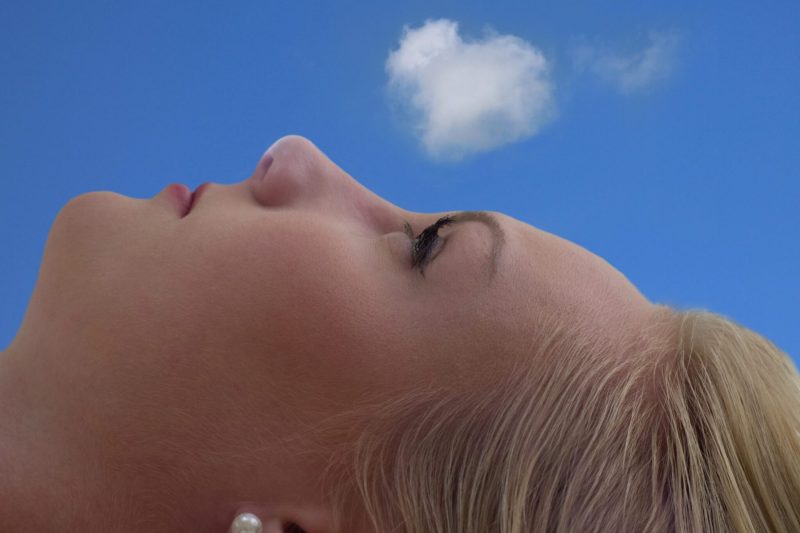 woman face looking up at sky