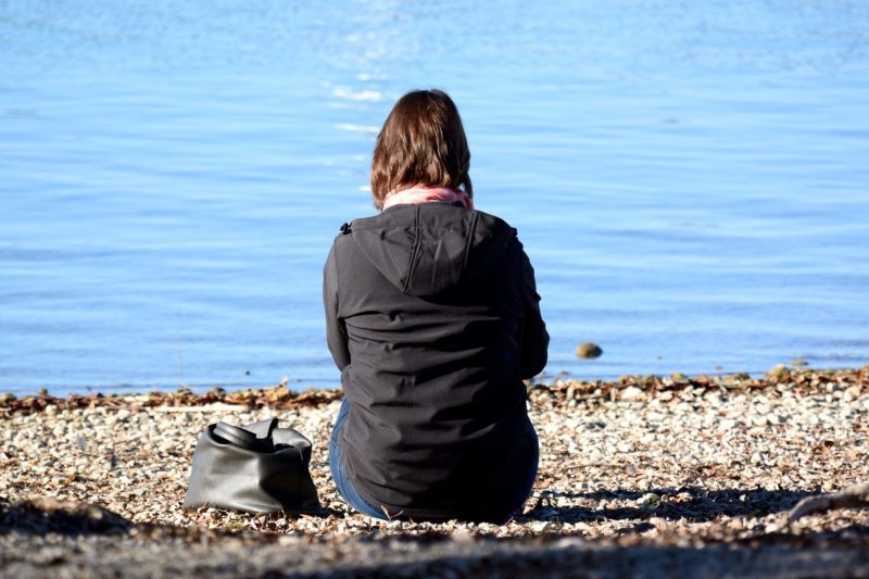 woman sitting on beach ryan fahlen