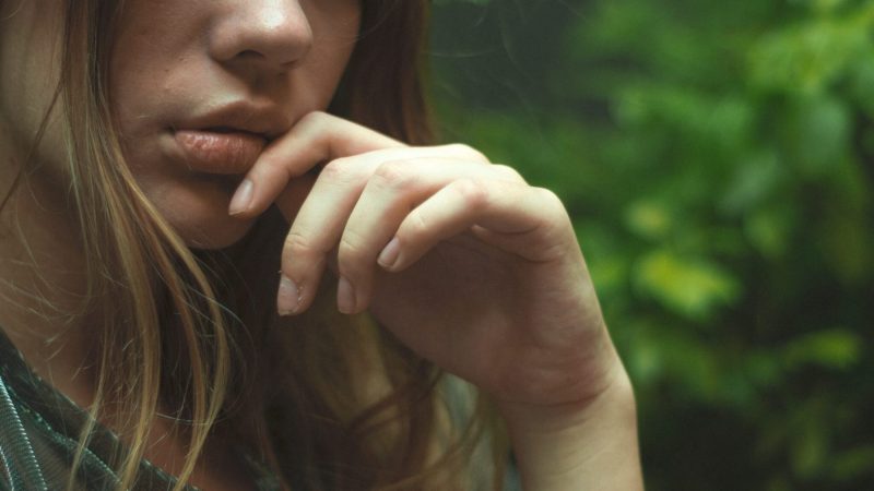 woman contemplating - sad space for content