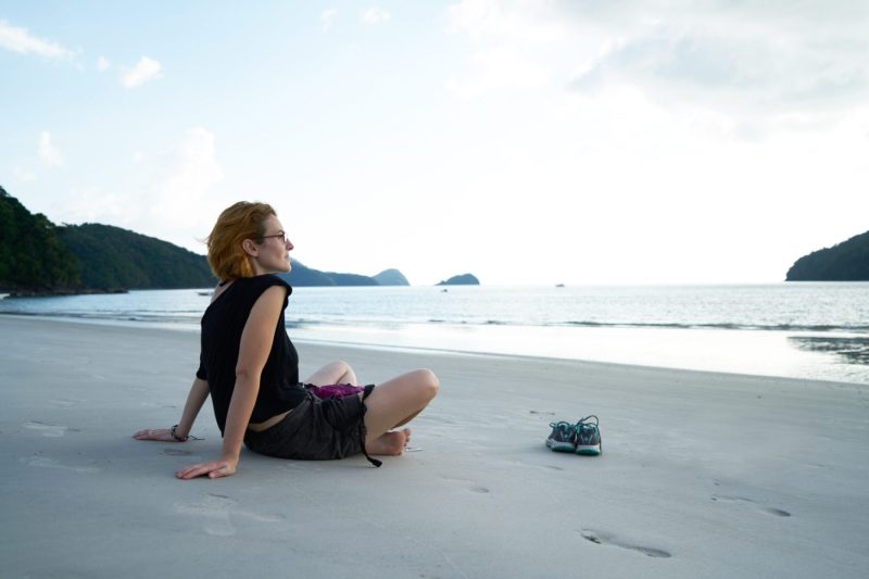 woman sitting on beach