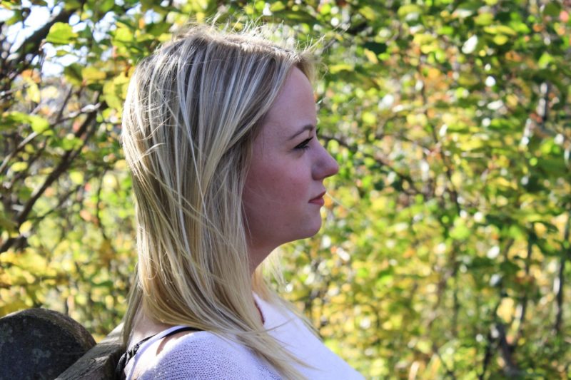 profile woman on bench