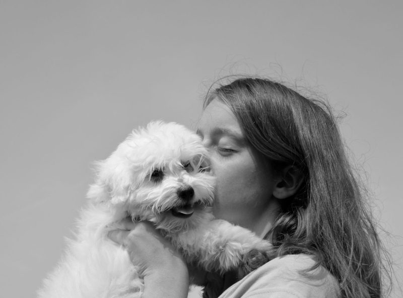 young womag snuggling mimi like dog