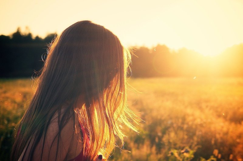 woman in grass field