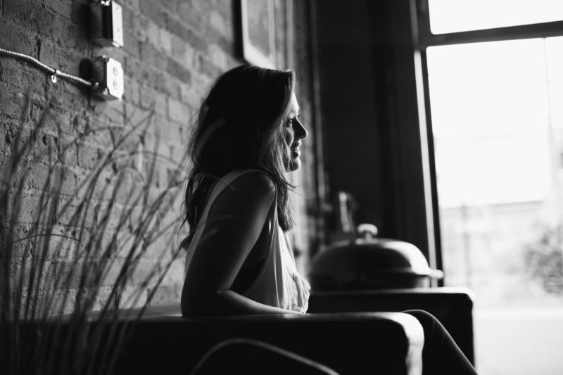 black and white of young woman looking right